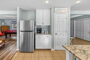 Frig, coffee bar, and pantry closet